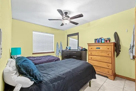 a bedroom with a bed and furniture