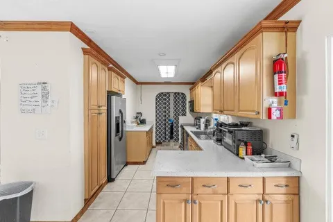 a bathroom with a sink a mirror and shower