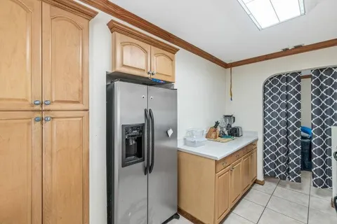 a utility room with cabinets washer and dryer