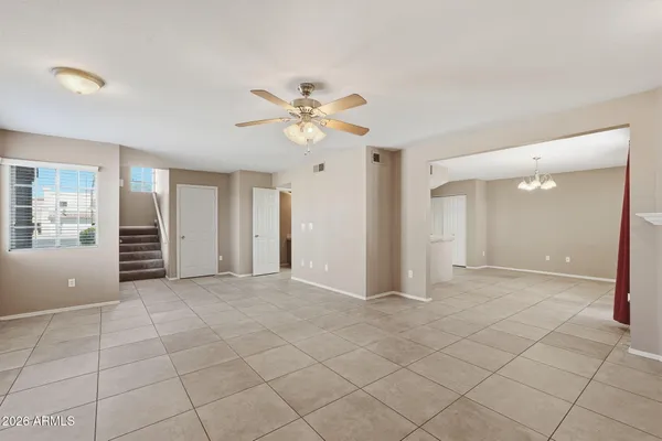 a utility room with stainless steel appliances granite countertop a sink and a window