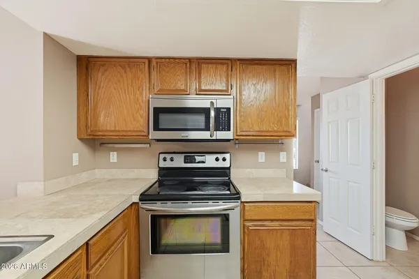 a kitchen with a sink and a counter top space
