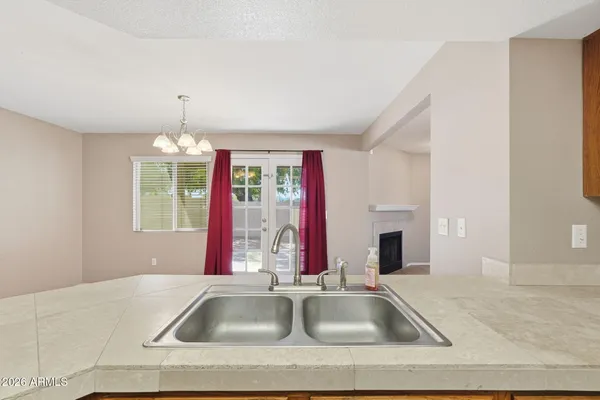 a view of an empty room with a ceiling fan