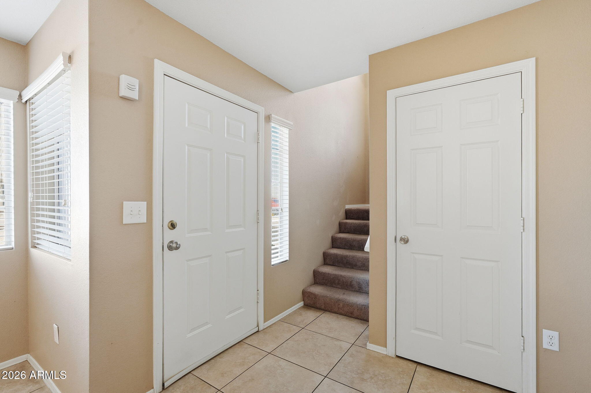 1229 North Alma School Road, Unit 1 Mesa, AZ 85201 - Photo 17 of 38 a view of a hallway with stairs
