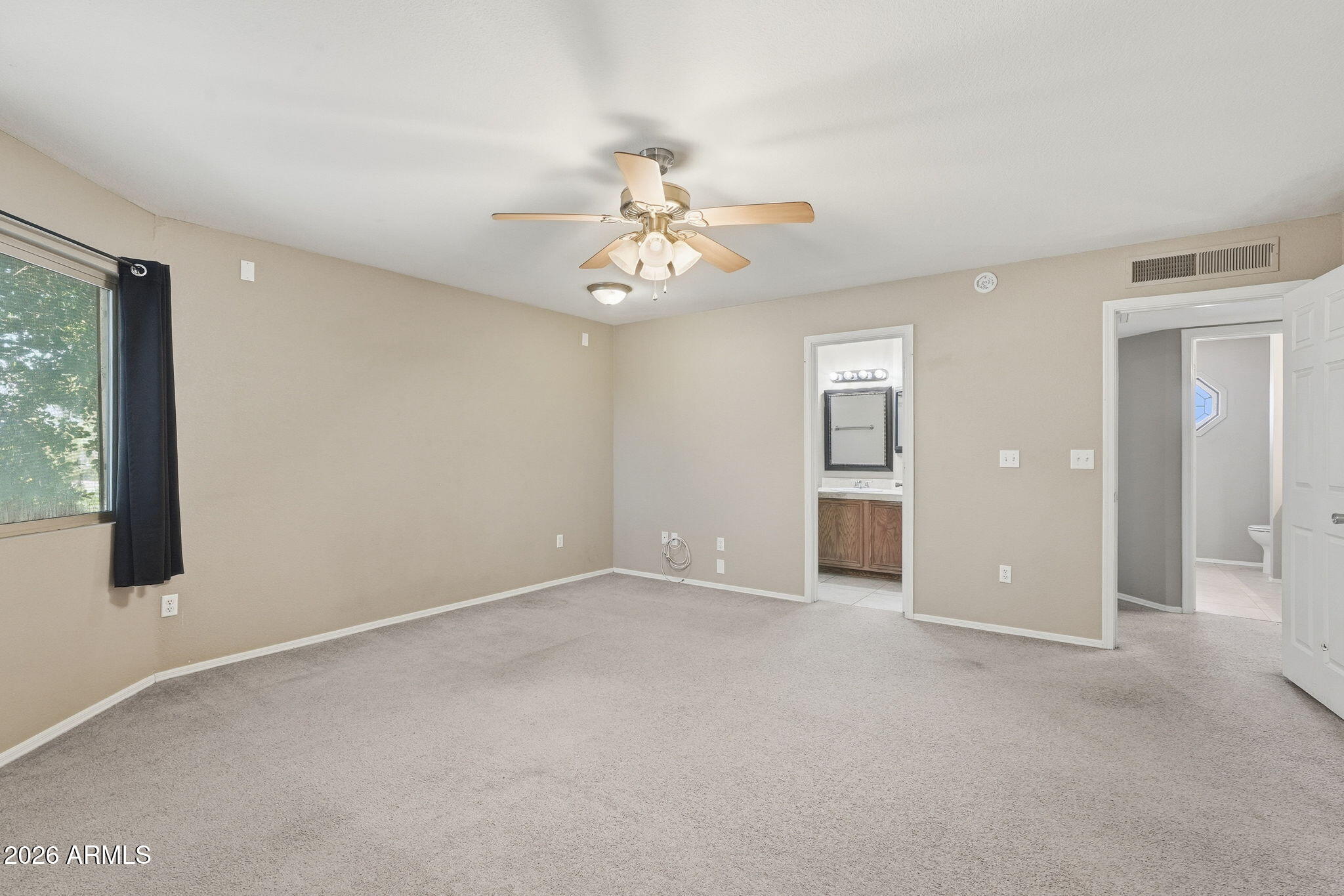 1229 North Alma School Road, Unit 1 Mesa, AZ 85201 - Photo 20 of 38 a view of an empty room with a window