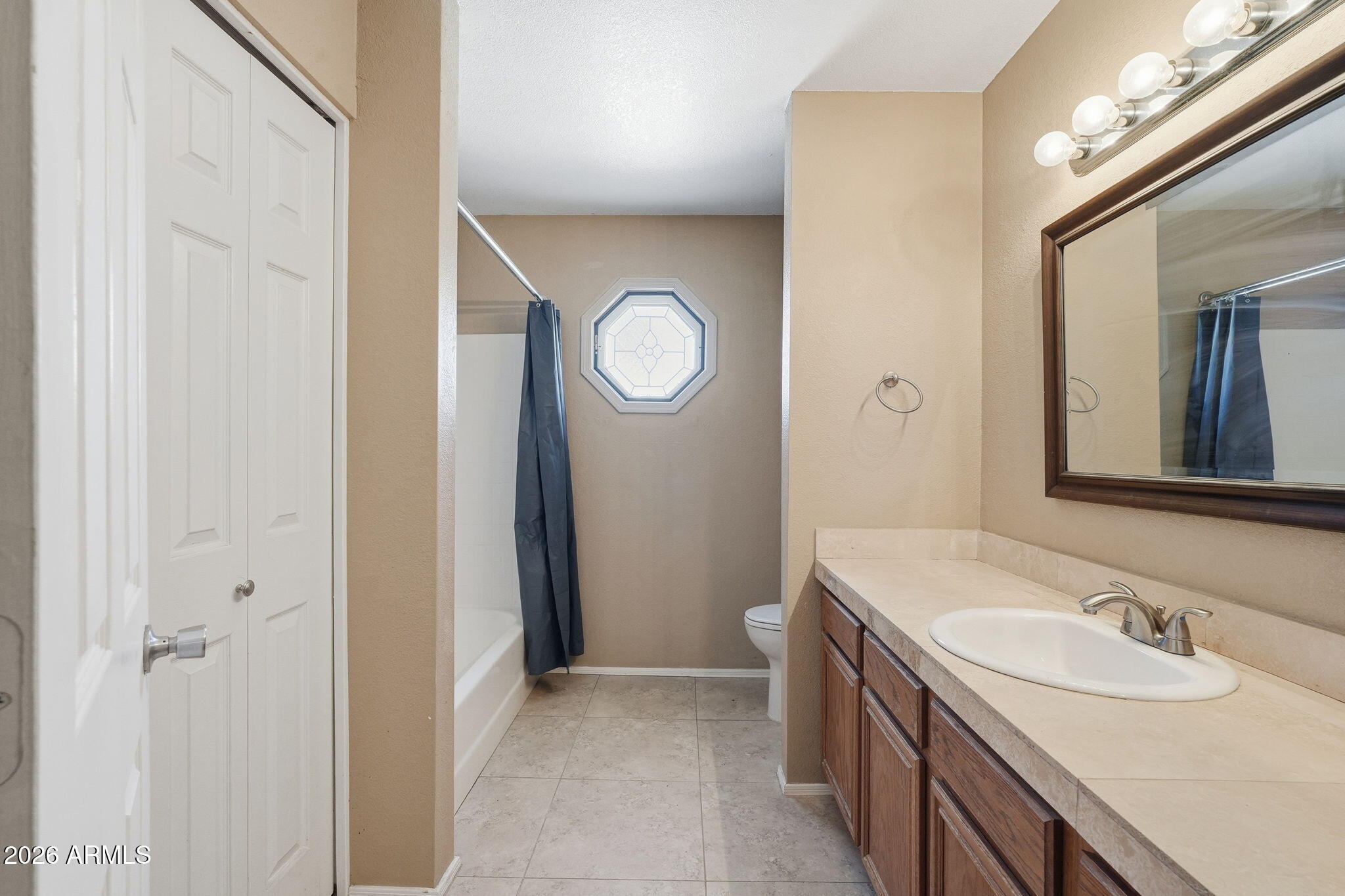 1229 North Alma School Road, Unit 1 Mesa, AZ 85201 - Photo 24 of 38 a bathroom with a sink and a mirror