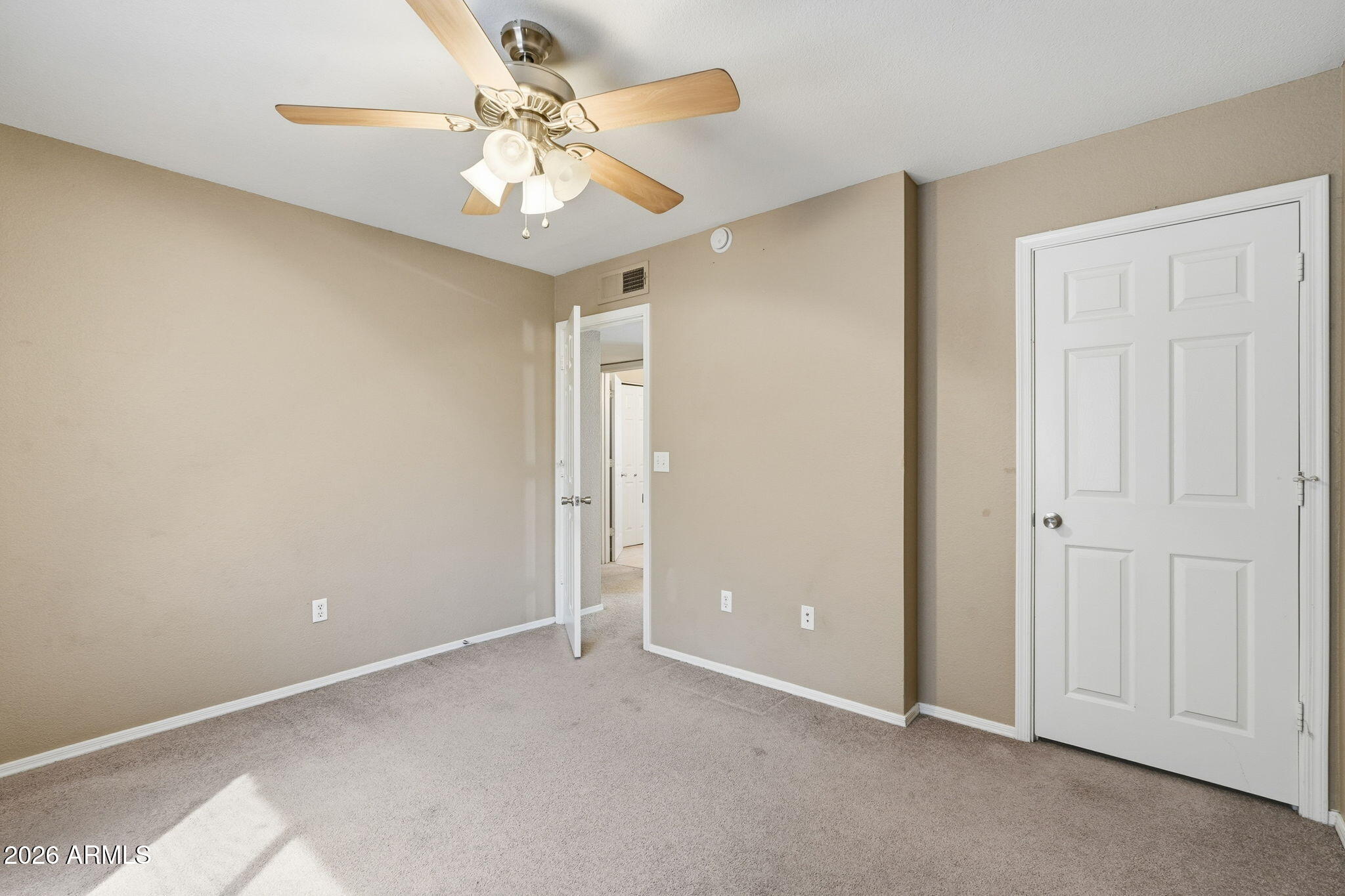 1229 North Alma School Road, Unit 1 Mesa, AZ 85201 - Photo 26 of 38 a view of an empty room and chandelier fan