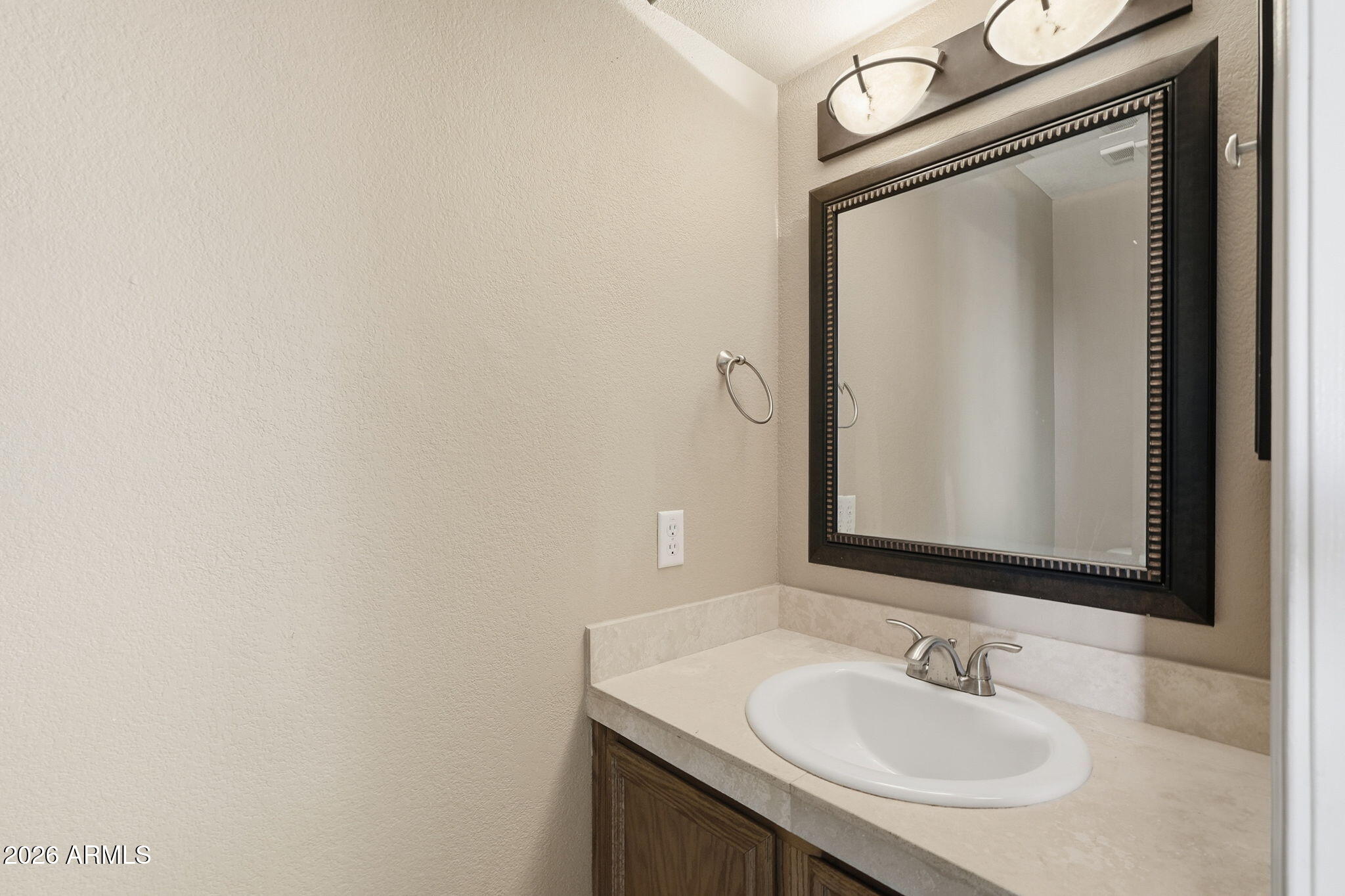1229 North Alma School Road, Unit 1 Mesa, AZ 85201 - Photo 27 of 38 a bathroom with a sink and a mirror
