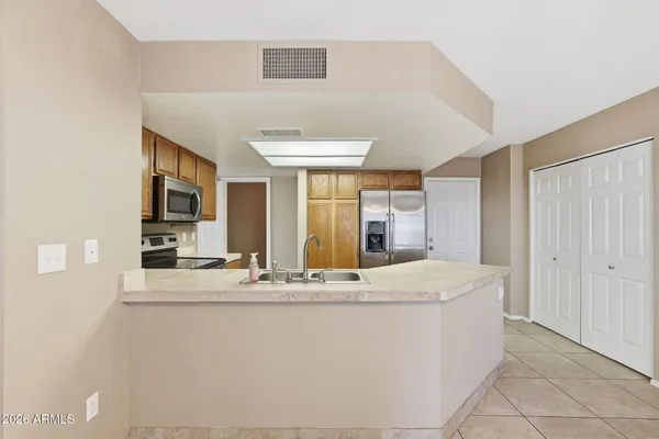 a spacious bedroom with a bed and a couch