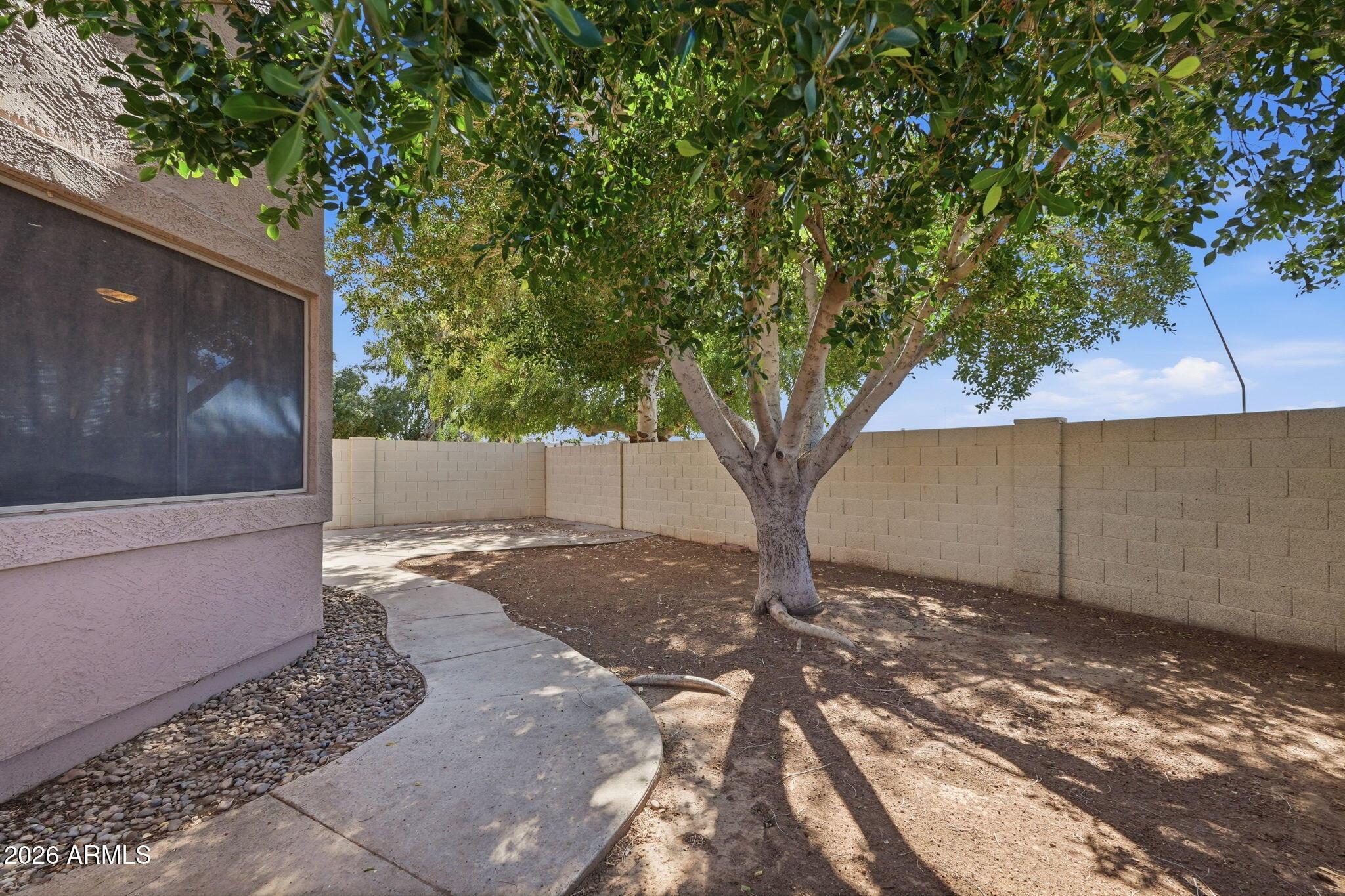 1229 North Alma School Road, Unit 1 Mesa, AZ 85201 - Photo 31 of 38 a view of a yard with a tree