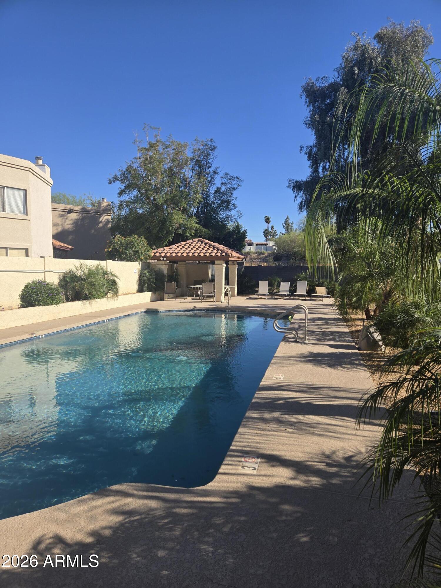 1229 North Alma School Road, Unit 1 Mesa, AZ 85201 - Photo 33 of 38 a view of swimming pool with outdoor seating