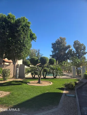 a view of a room with cabinet and mirrors
