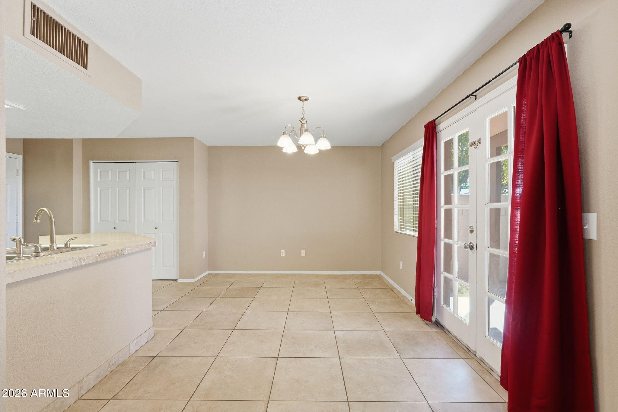 1229 North Alma School Road, Unit 1 Mesa, AZ 85201 - Photo 5 of 38 a view of a kitchen with a sink and cabinet