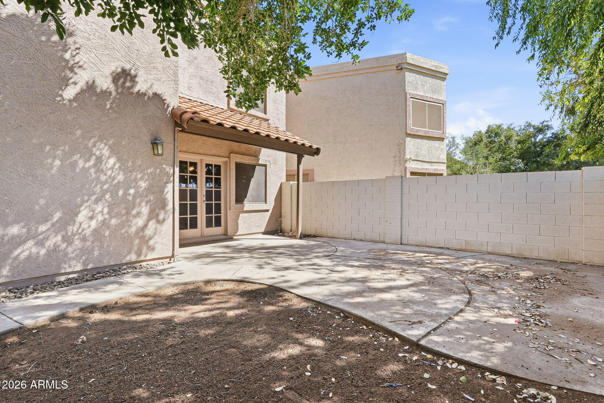 1229 North Alma School Road, Unit 1 Mesa, AZ 85201 - Photo 6 of 38 a view of a house with a yard and garage