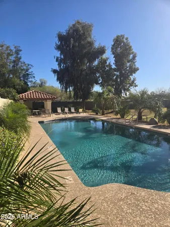 an empty room with fan and windows