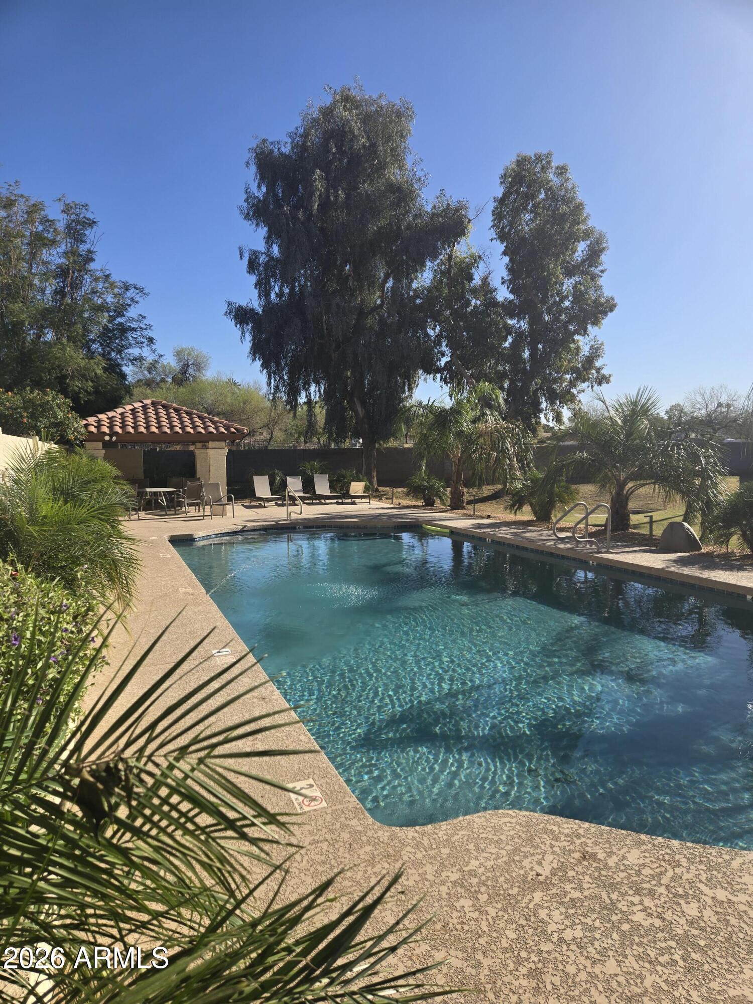 1229 North Alma School Road, Unit 1 Mesa, AZ 85201 - Photo 7 of 38 a view of a lake with a yard