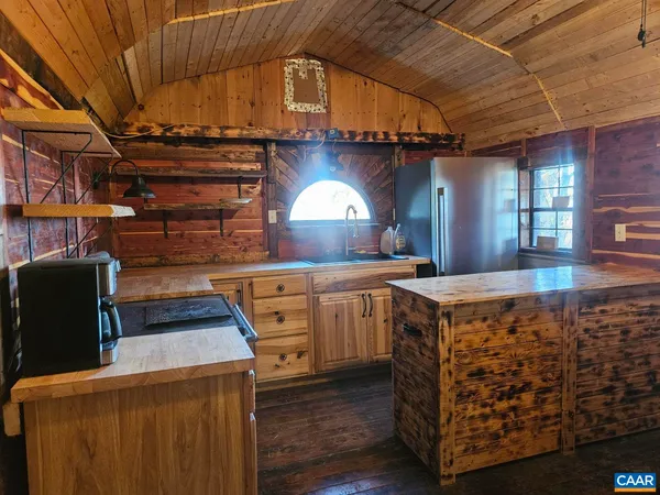 a kitchen with cabinets and window