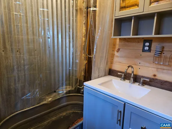 a bathroom with a sink and a mirror