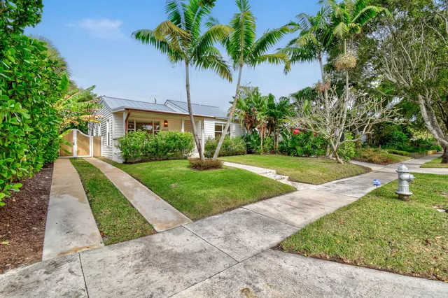 a view of a garden with a building in front of it