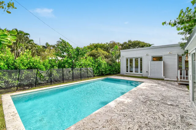 a backyard with a garden and entertaining space