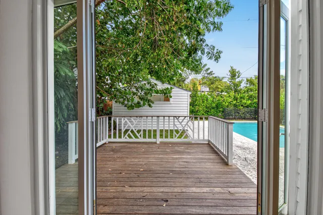 a view of balcony with wooden floor