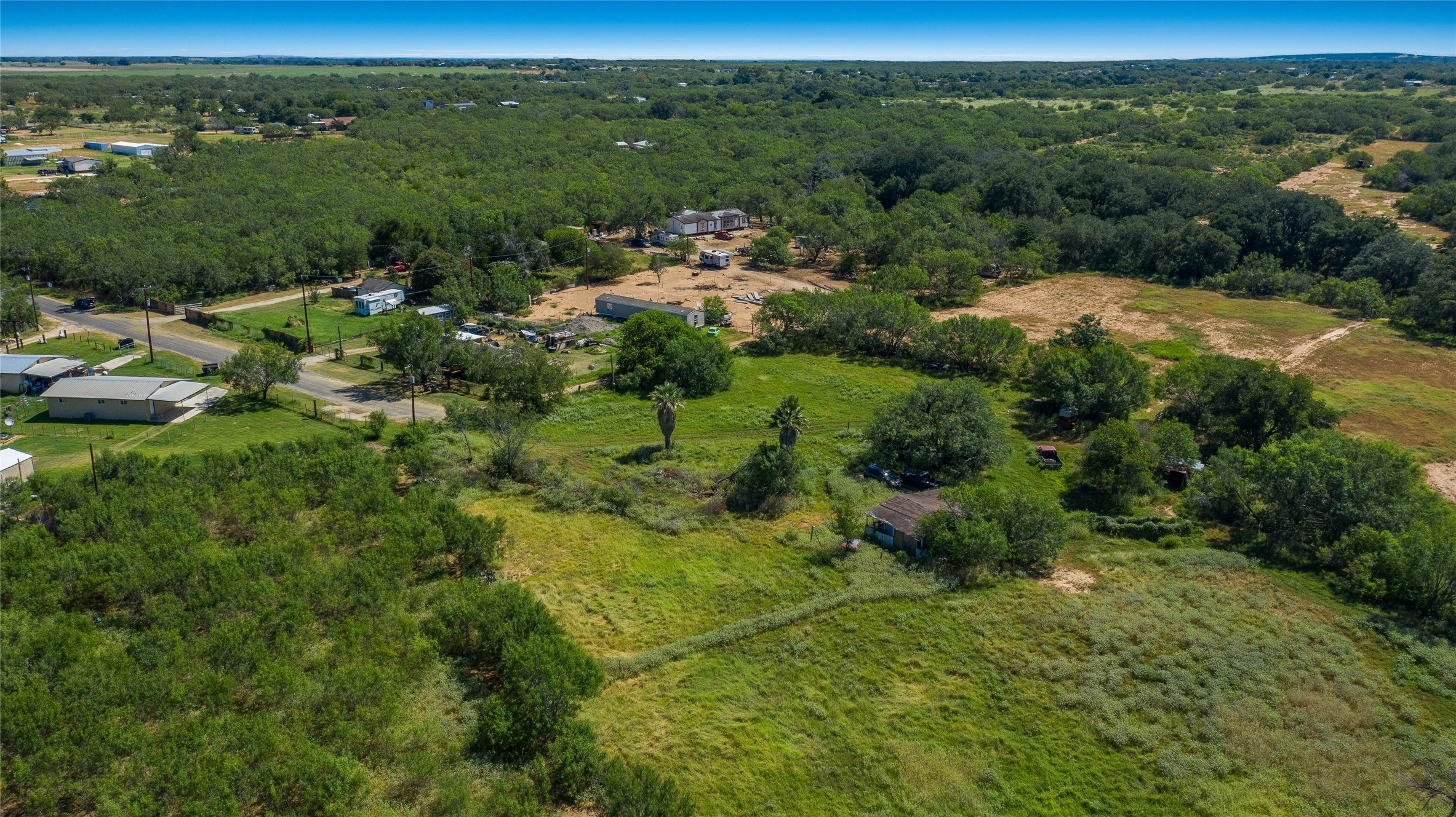 345 Pinn Road Lytle, TX 78052 - Photo 7 of 11 a view of a city with lush green forest