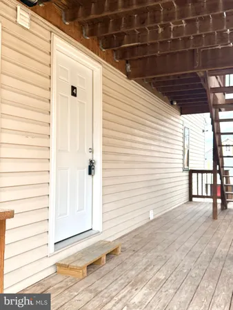 a view of a porch with a door