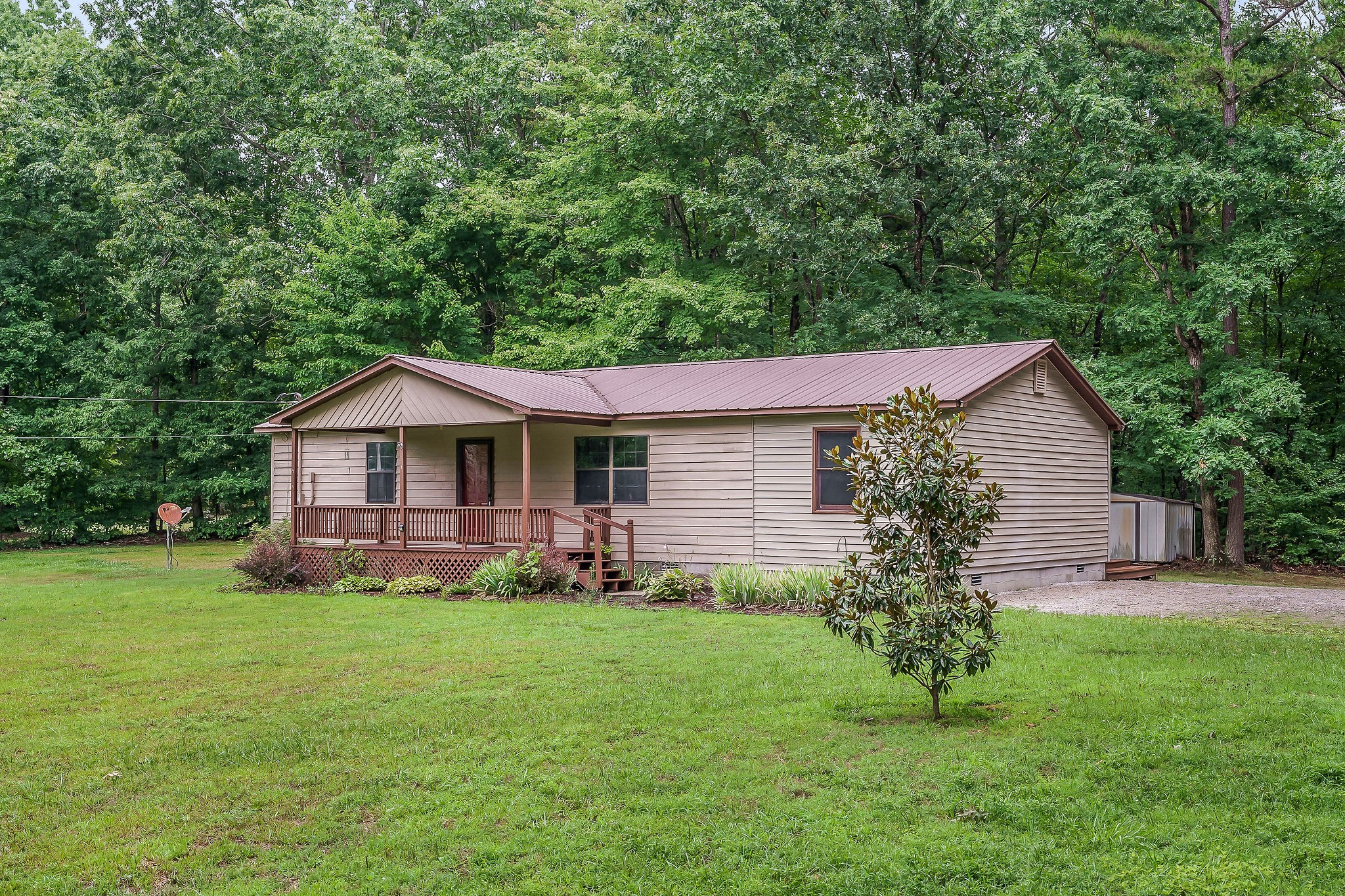 569 Robs Road Grimsley, TN 38565 - Photo 1 of 40 a front view of a house with garden
