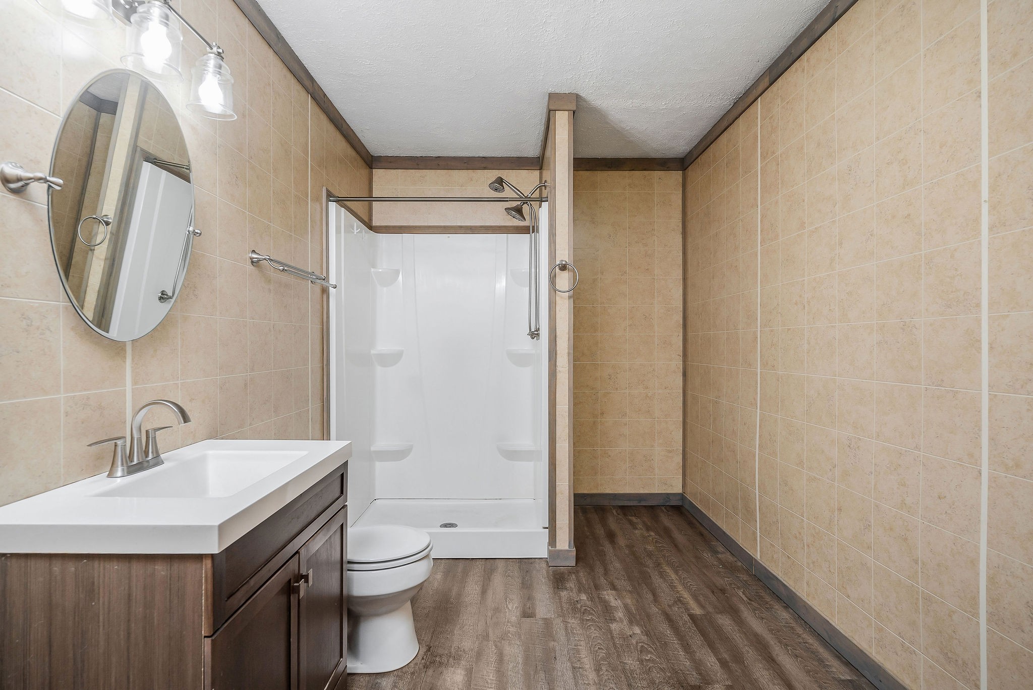 569 Robs Road Grimsley, TN 38565 - Photo 11 of 40 a bathroom with a granite countertop toilet sink and mirror