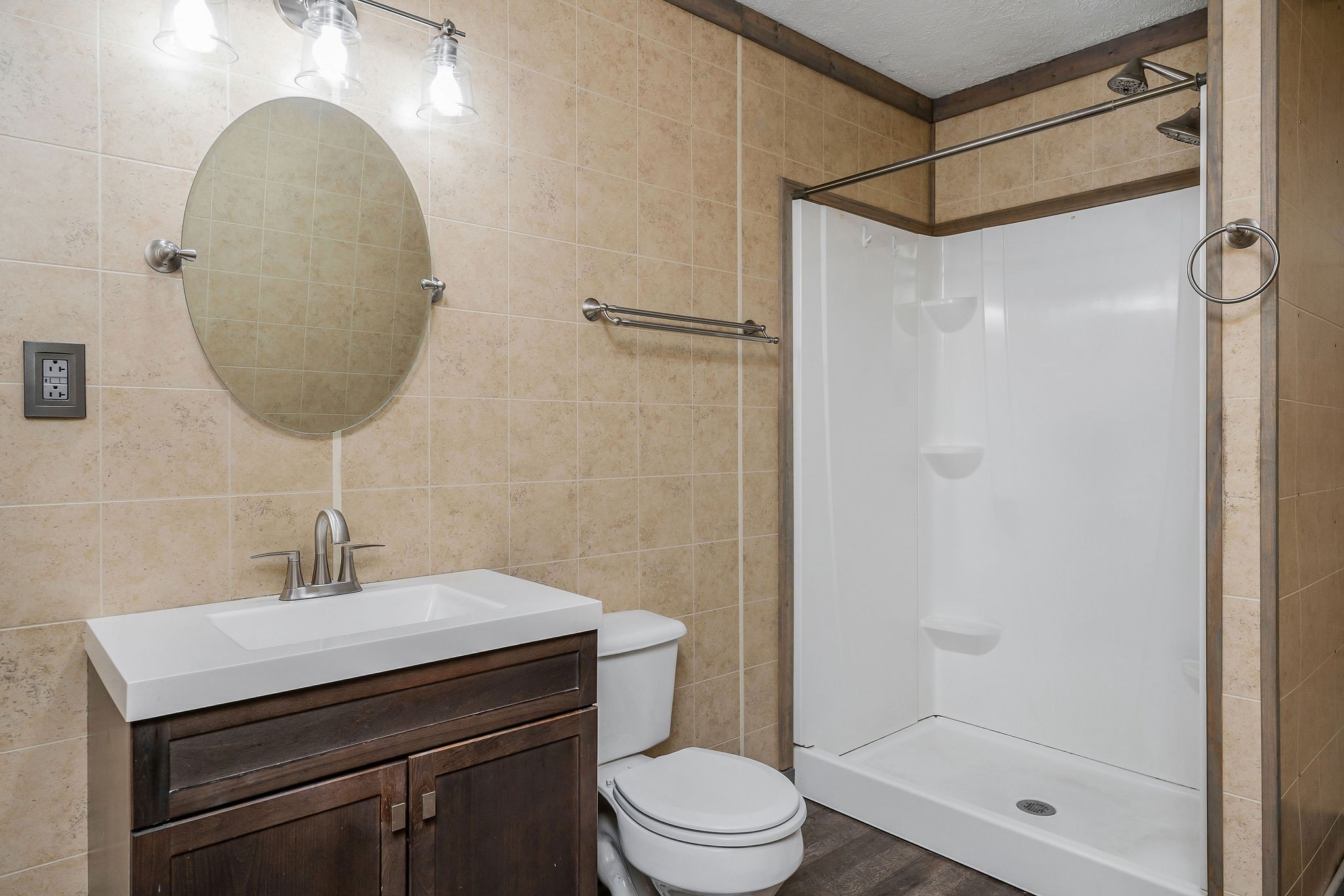 569 Robs Road Grimsley, TN 38565 - Photo 12 of 40 a bathroom with a sink a mirror a toilet and shower