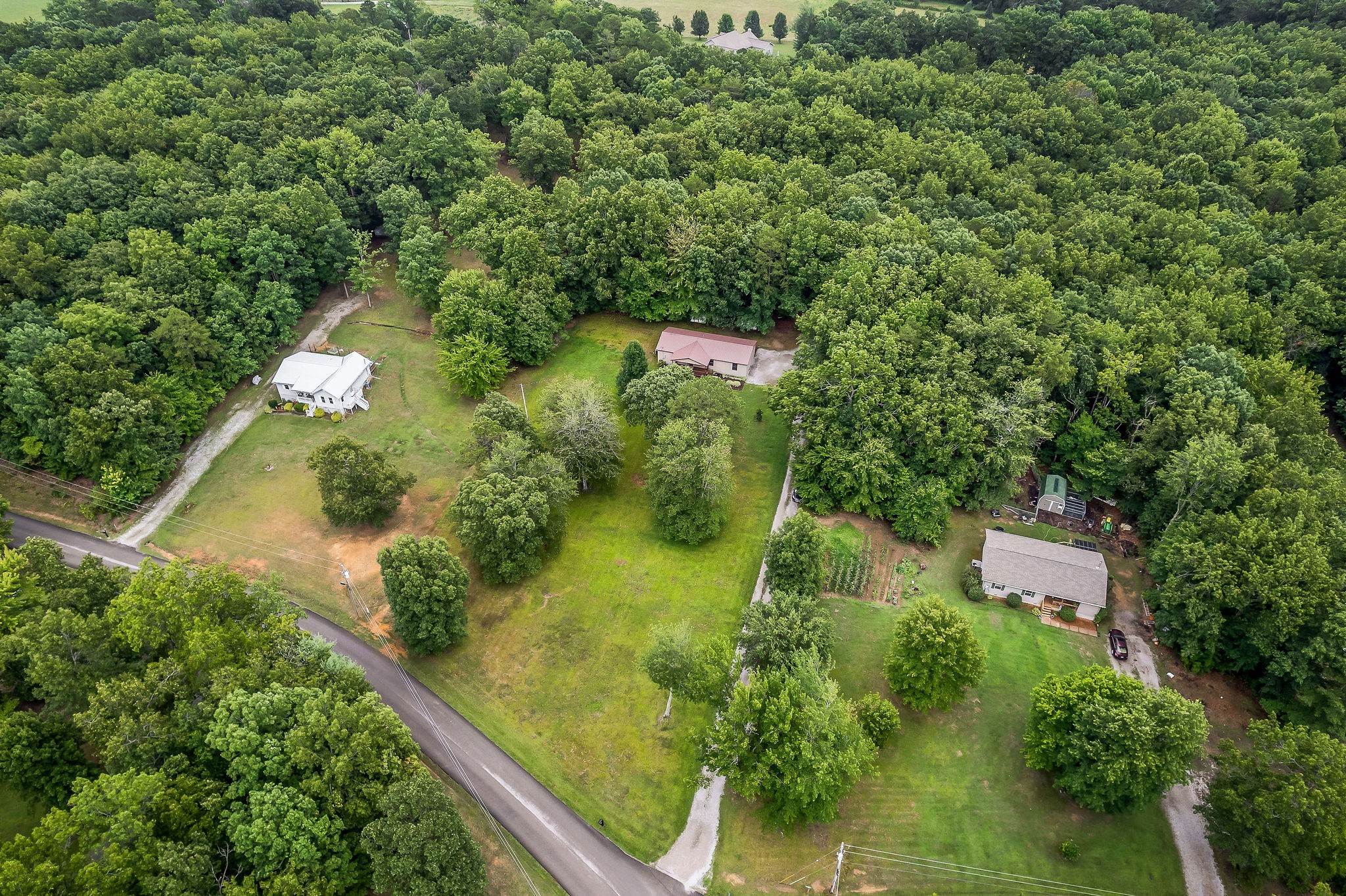 569 Robs Road Grimsley, TN 38565 - Photo 36 of 40 an aerial view of residential house with outdoor space and trees all around