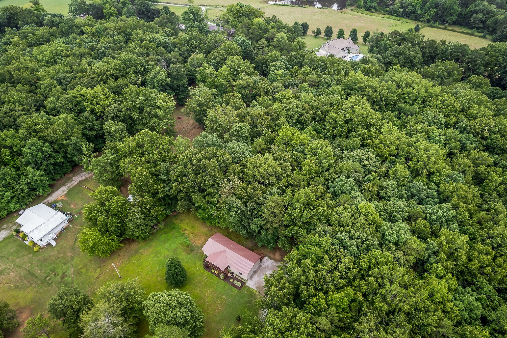 569 Robs Road Grimsley, TN 38565 - Photo 38 of 40 an aerial view of residential house with outdoor space and trees all around