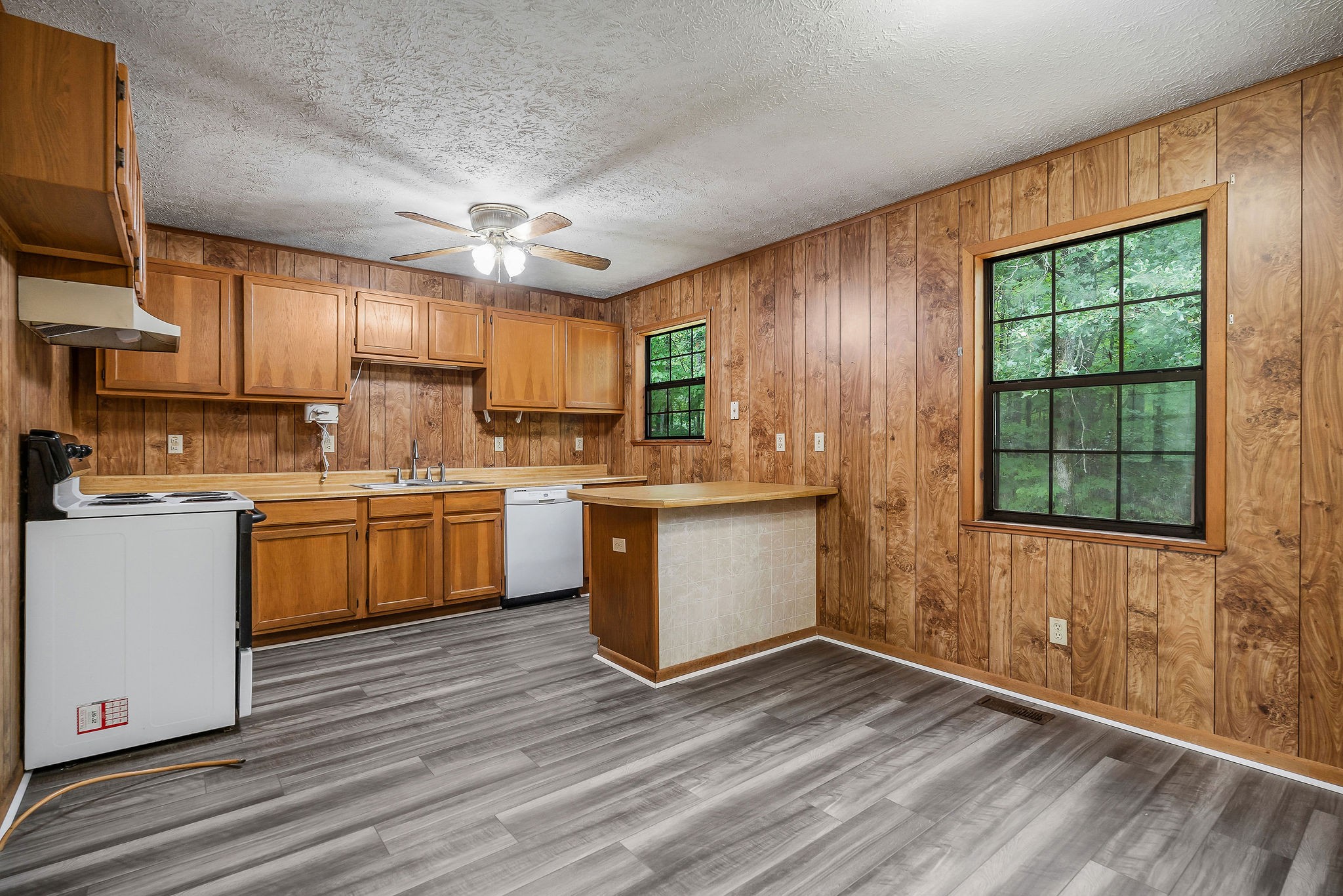 569 Robs Road Grimsley, TN 38565 - Photo 5 of 40 a kitchen with a sink window and cabinets