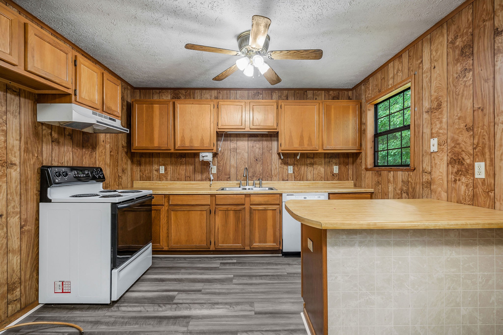569 Robs Road Grimsley, TN 38565 - Photo 6 of 40 a kitchen with a sink stove and cabinets