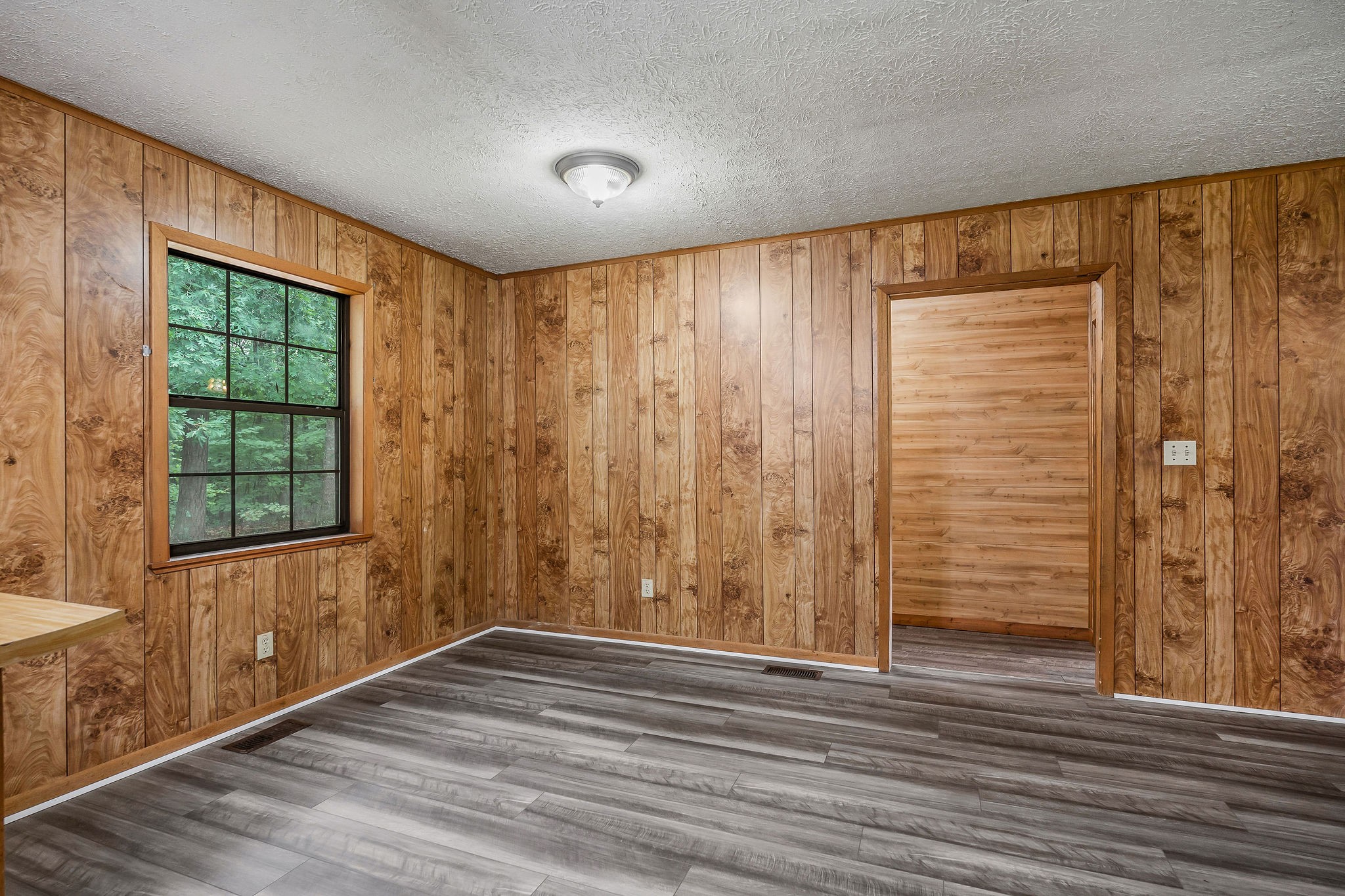 569 Robs Road Grimsley, TN 38565 - Photo 7 of 40 a view of empty room with wooden floor and fan