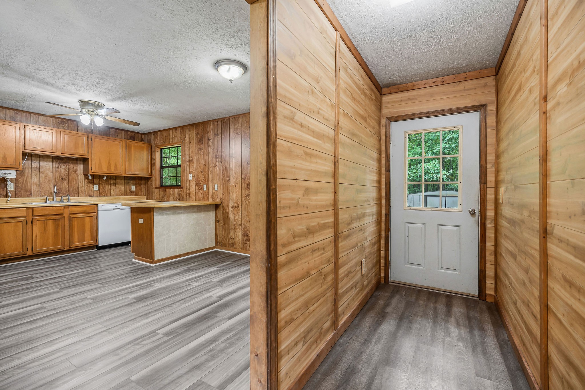 569 Robs Road Grimsley, TN 38565 - Photo 8 of 40 a kitchen with wooden floors and white walls
