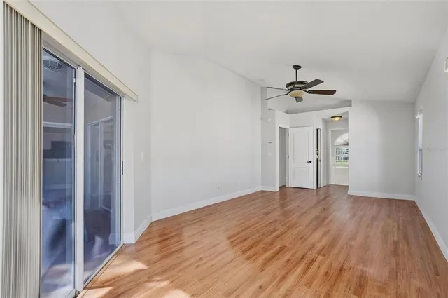 a bathroom with a tub a sink and a large mirror