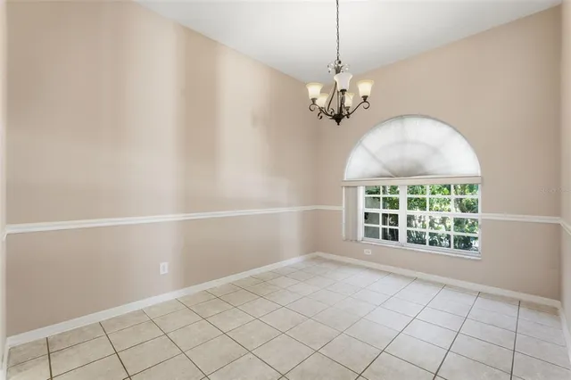 a kitchen with stainless steel appliances granite countertop a sink and white cabinets