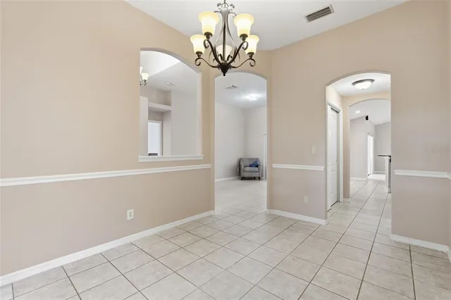 a kitchen with stainless steel appliances granite countertop a refrigerator and a stove