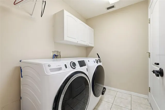 a kitchen with granite countertop a stove and a microwave