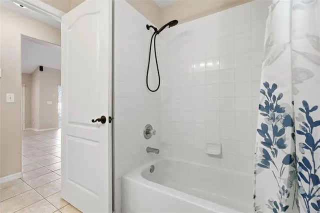 a view of a kitchen with kitchen island granite countertop a refrigerator and a stove top oven