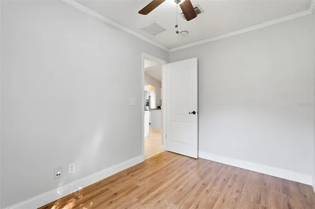 a bedroom with a bed and cabinets