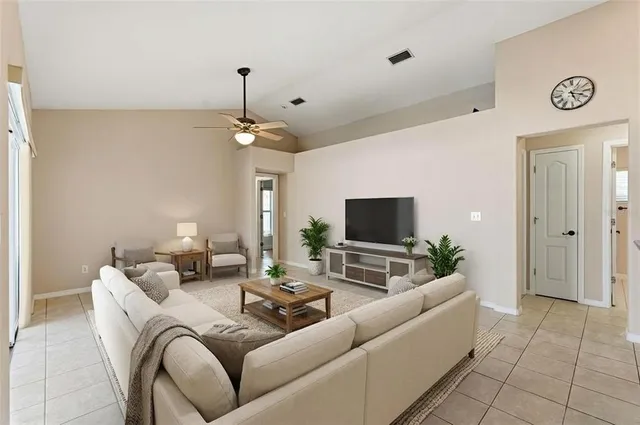 a view of a house with a yard and sitting area