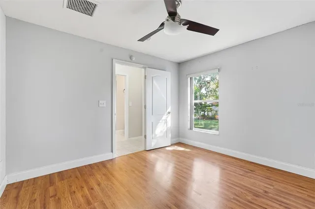 an aerial view of residential houses with outdoor space and street view