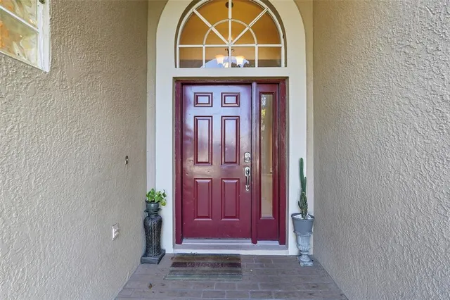 a view of front door with red door