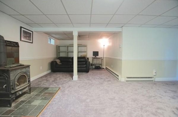 54 Forest Road Salisbury, MA 01952 - Photo 11 of 17 a view of a livingroom with furniture and a flat screen tv