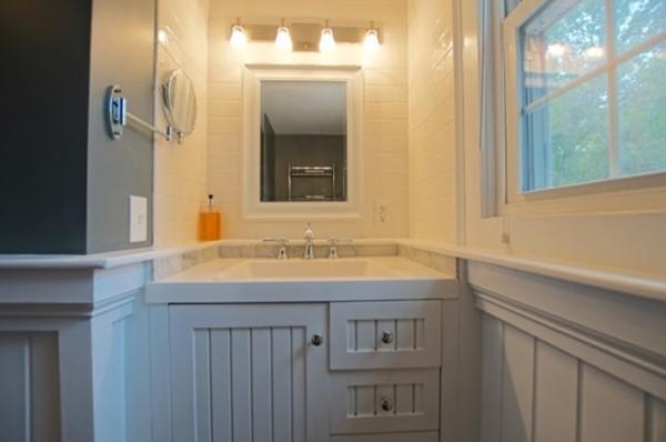 54 Forest Road Salisbury, MA 01952 - Photo 14 of 17 a bathroom with a sink and a mirror