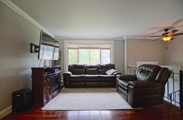 54 Forest Road Salisbury, MA 01952 - Photo 6 of 17 a living room with furniture and a flat screen tv