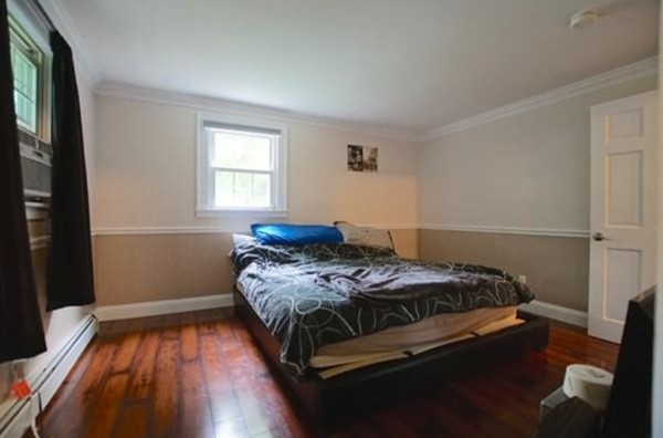 54 Forest Road Salisbury, MA 01952 - Photo 7 of 17 a bedroom with a bed and a window