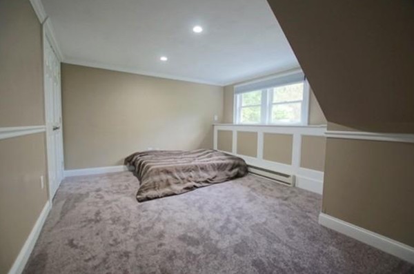 54 Forest Road Salisbury, MA 01952 - Photo 10 of 17 a bedroom with a bed and a window