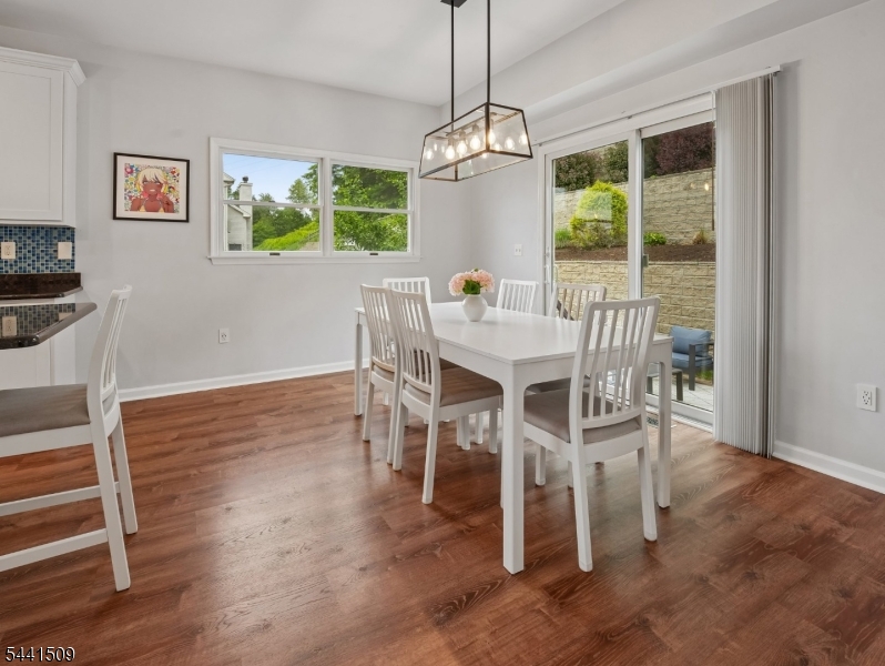 610 River Road Chatham, NJ 07928 - Photo 12 of 42 a view of a dining room with furniture window and wooden floor
